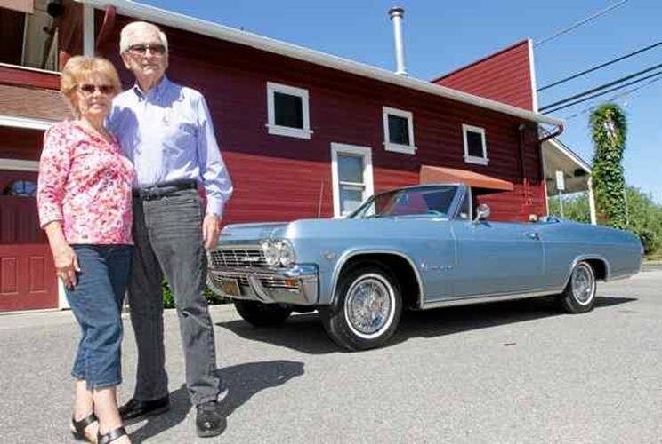 Charlie and Loretta Carroll of Chico stand with their 1965 Chevy Impala that will be on the May 24 episode of the TV show “Car Hunters.”