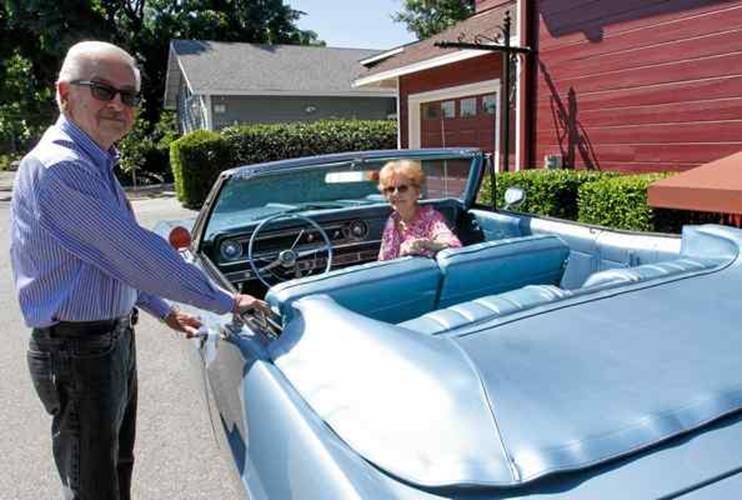 Charlie and Loretta Carroll of Chico stand with their robin-egg blue 1965 Chevy Impala that will be on the History Channel’s show “Car Hunters.”